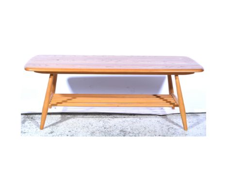 Ercol, an occasional coffee table, magazine undertier, shape 459, applied gilt and brown paper label, length 105cm, width 46c