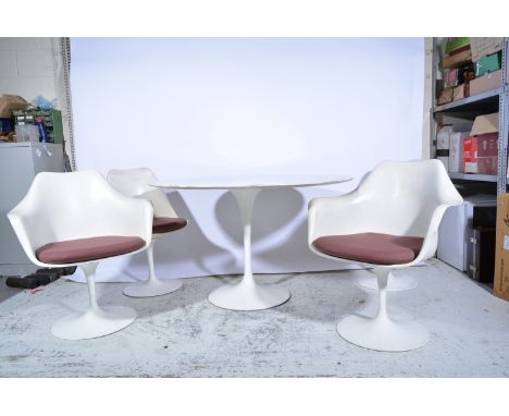 A 'Tulip' dining table and chairs, after a design by Eero Saarinen, circa 1970, comprising circular table, and a set of six c