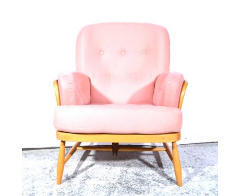 Ercol, a 'Jubilee' low easy chair and stool, shape 76 and and 871, pink buttoned shaped pads, applied gilt and brown paper la
