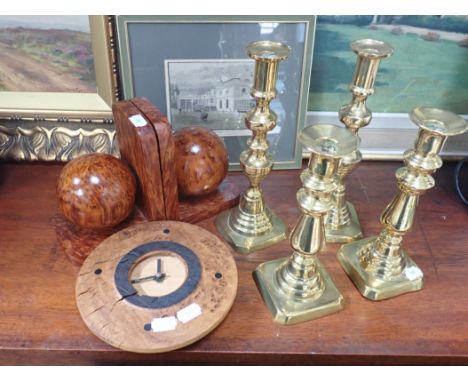 TWO PAIRS OF 19TH CENTURY BRASS CANDLESTICKS a pair of burr-wood 'ball' bookends and a similar clock