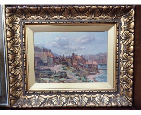 R W E... (EAMES ?): FISHING VILLAGE, POSSIBLY CORNWALL, OIL ON CANVAS in gilt frame 44 x 54 cm overall (chips to frame)