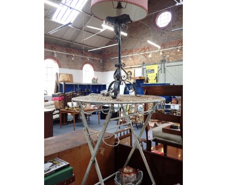 A METAL FOLDING GARDEN TABLE and a similar lamp