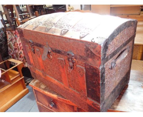 A 19TH CENTURY DOME TOP TRUNK with stamped tin decoration, 72cm wide