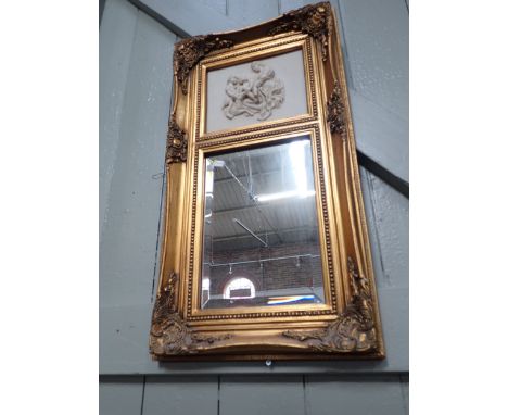 A REPRODUCTION GILT FRAMED MIRROR with reconstituted marble relief panel 'The Virgin with the infant Christ and St John' 77 x