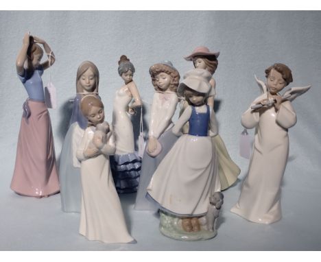 EIGHT NAO FIGURINES including an angelic flautist