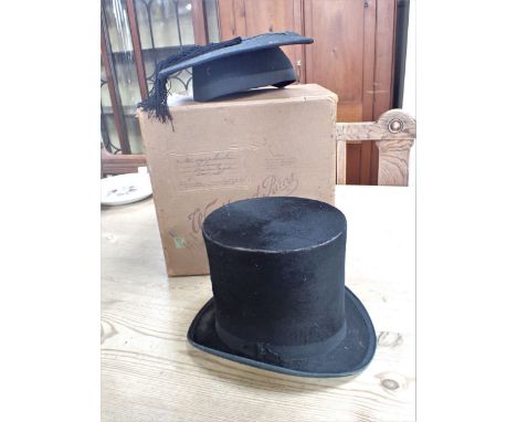 A TOP HAT AND A 'MORTAR BOARD' (Inner measurement of hat 15.5 x 19 cm) in a vintage card hat box, both worn and moth damaged