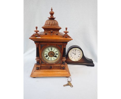 AN EDWARDIAN WALNUT CASED MANTEL CLOCK striking on a gong, and a modern 'Napoleon hat' clock