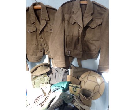 A 1940 PATTERN BATTLEDRESS BLOUSE, caps, webbing, a helmet, and other militaria (moth damage)