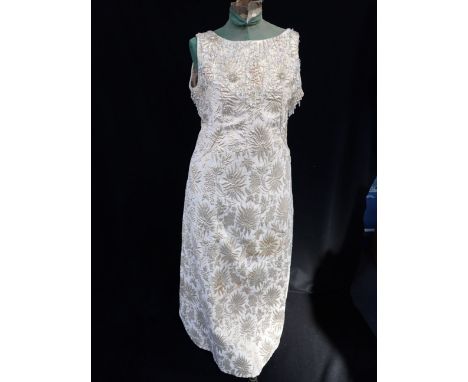 A VINTAGE 1960S EVENING DRESS by 'Panache' 20, Beauchamp Place SW3, decorated with gold lurex thread and glass beads, in the 