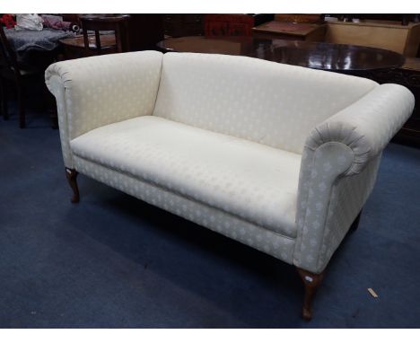 A TWO SEATER SOFA upholstered in cream material on cabriole legs, 155cm wide