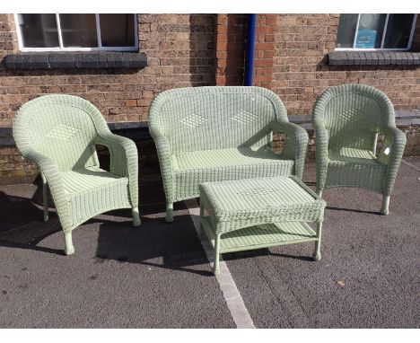 A FOUR PIECE VINTAGE STYLE GREEN WOVEN PLASTIC CONSERVATORY SUITE the sofa 125 cm long