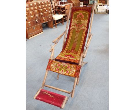 AN EDWARDIAN BEECH FOLDING GARDEN CHAIR with original 'carpet' upholstery