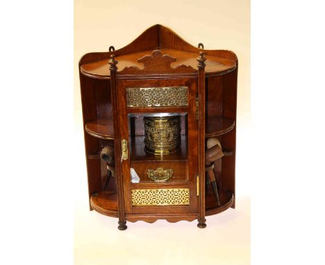 Victorian oak corner smokers cabinet with glazed door containing brass caddy and four pipes