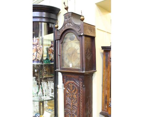 Antique carved oak 8 day longcase clock having arched brass and silvered dial signed Jn Agar, York