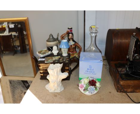 A Tony Carter tea pot; decanter and stopper; Royal Doulton floral encrusted ornament; Belleek Green Stamp vase in the form of