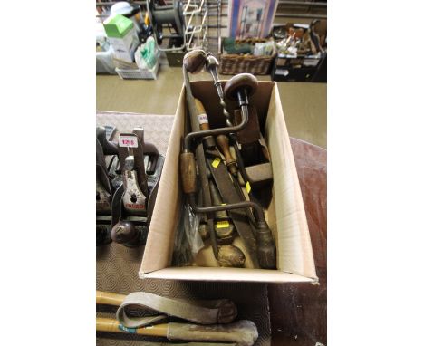 A collection of various vintage wood working tools including a moulding plane, bit and brace; various drills etc