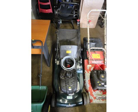 A Hayter Harrier 56 self propelled rotary garden lawn mower with electric key start charger and rear metal roller and a part 