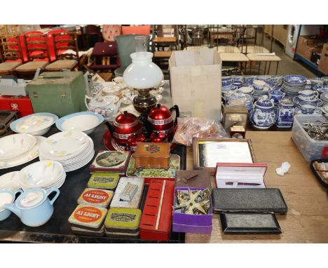 A collection of advertising tins, insulated tea ware, oil lamp, mantel clock, drawing instruments etc 