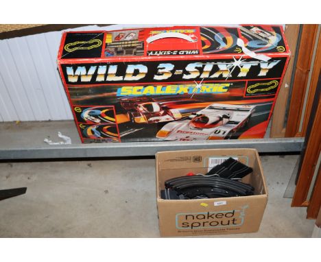 A Scalextric set, unknown if complete together with a box of Scalextric track