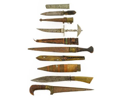 A 19th Century Indian Pesh Kabz, with 21cm T section steel blade, brass bolster and horn pistol grip hilt, 33cm; a Bhutanese 