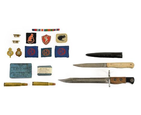 A Second World War Fighting Knife, with 14.5cm clip point steel blade, bleached beech grip scales and black enamelled steel s