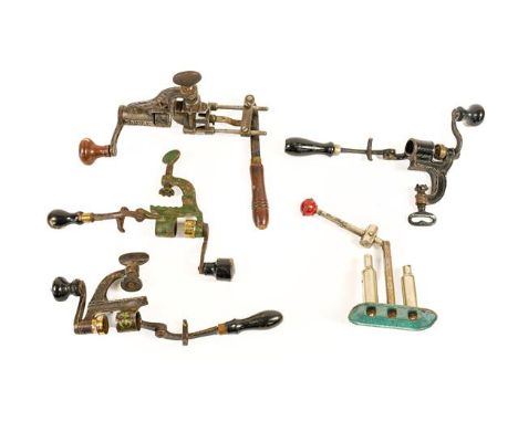 A Collection of Reloading Equipment, comprising a 12 bore capper/decappper and four roll turnover tools (4).