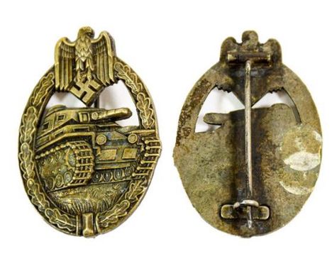 A German Third Reich Panzer Assault Badge in Bronze, of die struck construction with solid back and a bronze washed finish, t