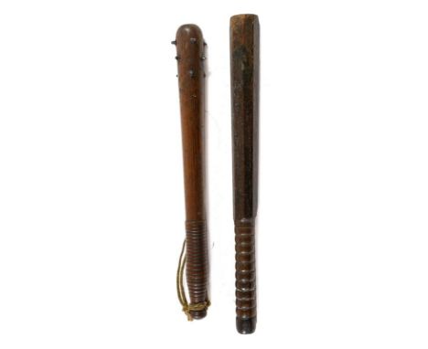 A First World War Mahogany Trench Club/Truncheon, the upper section inset with a lead weight and bands of hob nails, with car