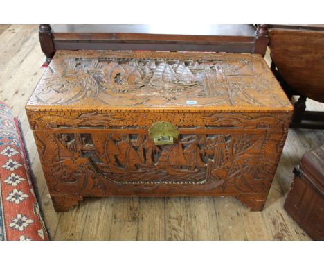 A Chinese carved camphor wood trunk
