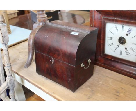 An early 19th Century mahogany caddy with fitted bottles