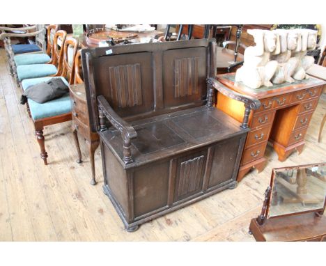 A c1950's oak monks bench