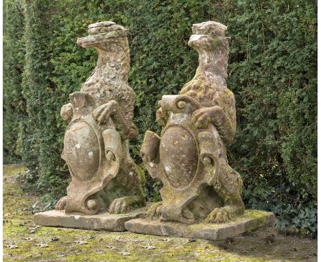 Garden statues: A pair of Victorian carved red sandstone armorial gate pier beasts, circa 1860, 122cm highPart of the Irish C