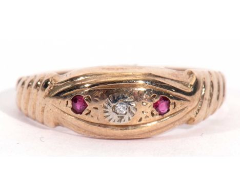 9ct gold diamond and ruby boat shaped ring centring a small single diamond flanked by two small rubies, Birmingham 1971, size