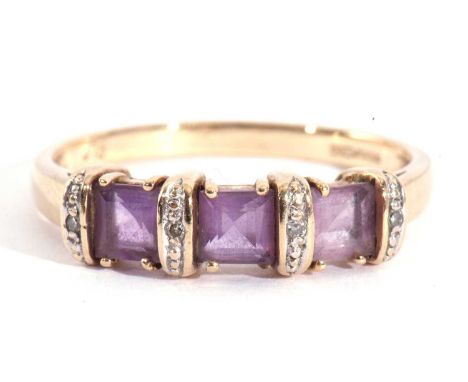 Modern 9ct gold amethyst and diamond ring featuring three square shaped amethysts between four gold batons, each highlighted 