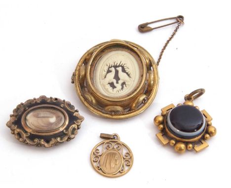 Mixed Lot: Victorian banded agate mourning brooch, a Victorian gilt metal black enamel mourning brooch with centre glazed pan