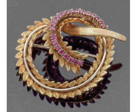18ct gold and ruby set brooch, an entwined garland design having chased and engraved detail, highlighted with 23 small round 