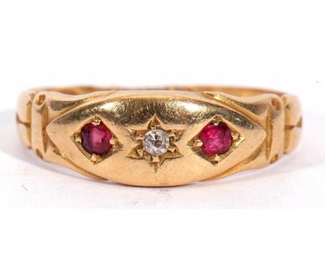 Antique 18ct gold diamond and ruby ring centring a small old cut diamond flanked by two round cut rubies, each in engraved se