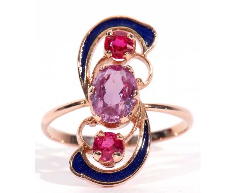 Russian amethyst, enamel and red stone ring centring an oval faceted amethyst raised between two small red round cut stones, 