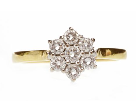 DIAMOND CLUSTER RINGset with round brilliant cut diamonds in a daisy cluster formation, the diamonds totalling approximately 