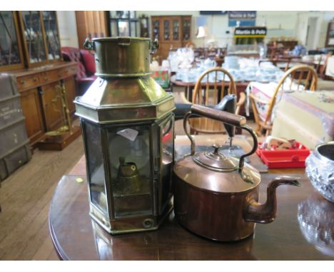 A brass ship's lamp 40cm high and a copper kettle (2)