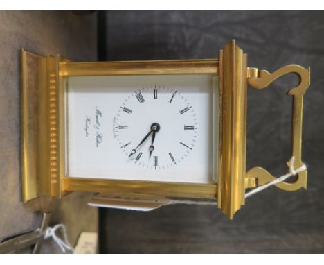 A brass carriage clock time piece, retailed by Morrell and Hilton, Huntingdon, 15.5 cm high