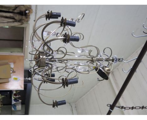 A brass and crystal nine light chandelier