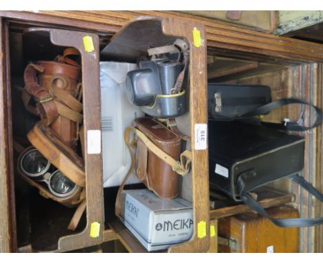 A Eumig Makro Sound 65XL Cine camera, another cine camera, four pairs of binoculars and other cameras