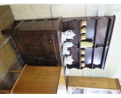A dark oak Ercol dresser and rack, with two short drawers and two cupboard doors, 123cm