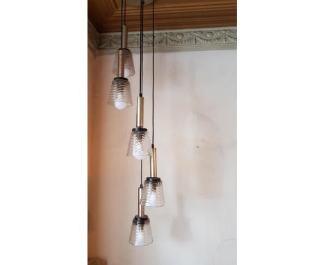 A 1960s chrome and glass five light chandelier and four other shades