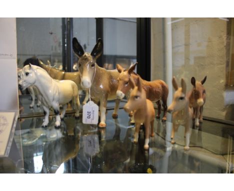 A Royal Doulton figure of a grey Shetland pony 13.5cm high, a Melba ware figure of a donkey 17.5cm high and four Beswick figu