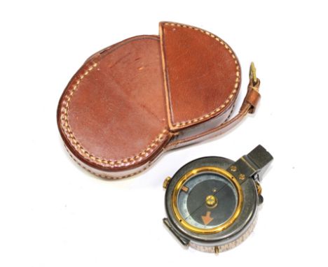 A World War I brass compass by W.H. Steward Ltd, with mother of pearl dial, 5cm diameter, with a leather case