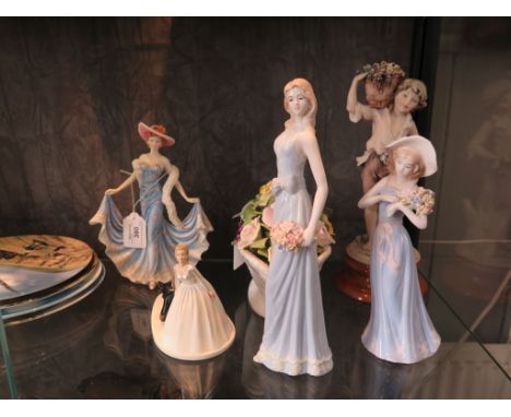 Four Royal Doulton limited edition collectors plates from The Heroes of the Sky series, a large Nao figure of a lady, an Ayns