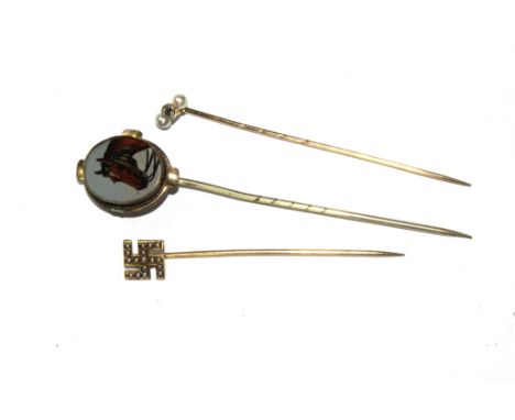 Three gold stick pins to include pearl and diamond, a horses head and a Chinese symbol