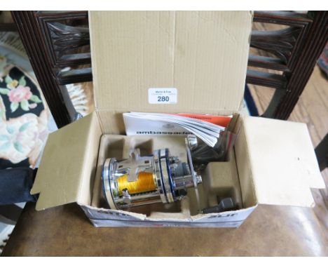 An Abu Garcia Ambassador 7000 C4LD fishing reel, with box and manual